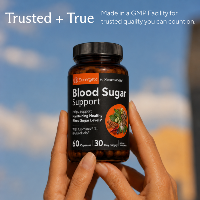 A person's hands holding a bottle of Sungeretics Blood Sugar Support dietary supplement against a blurred outdoor background of blue sky and clouds. White text overlays at the top read 'Trusted + True' and 'Made in a GMP Facility for trusted quality you can count on'.